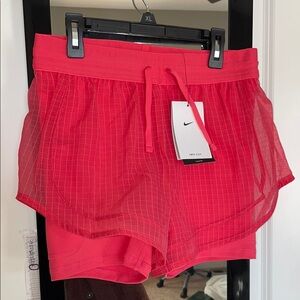 Women’s Nike running division Dri fit shorts in aster pink